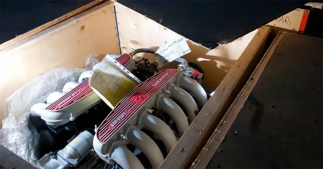 Ferrari engine securely packed inside a shipping crate, ready for transportation from the Eurospares warehouse.