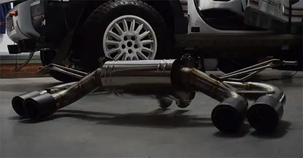 QuickSilver stainless steel exhaust on the floor waiting to be installed on the car in the QuickSilver workshop.