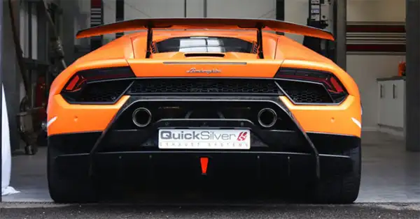 Orange Lamborghini rear view with QuickSilver exhaust tips and QuickSilver number plate.